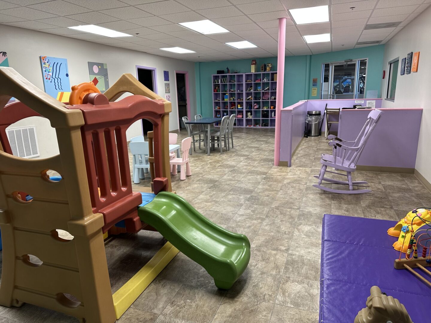 IMG_3237 A play room with toys and chairs in it